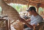 Bamboo craftsmen bend with market to survive