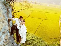 Daring couple pose for wedding photo on a cliff