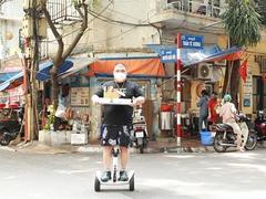 Noodle soup shop owner makes deliveries on hoverboard