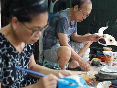 Mask-making couple get busy for Mid-Autumn Festival