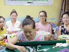 Weaving new hope: reviving Quất Động embroidery