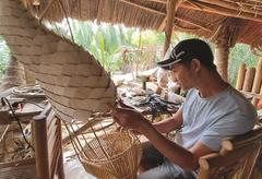 Bamboo craftsmen bend with market to survive