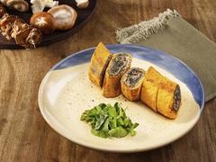 Mugwort and seasonal mushroom in egg roll